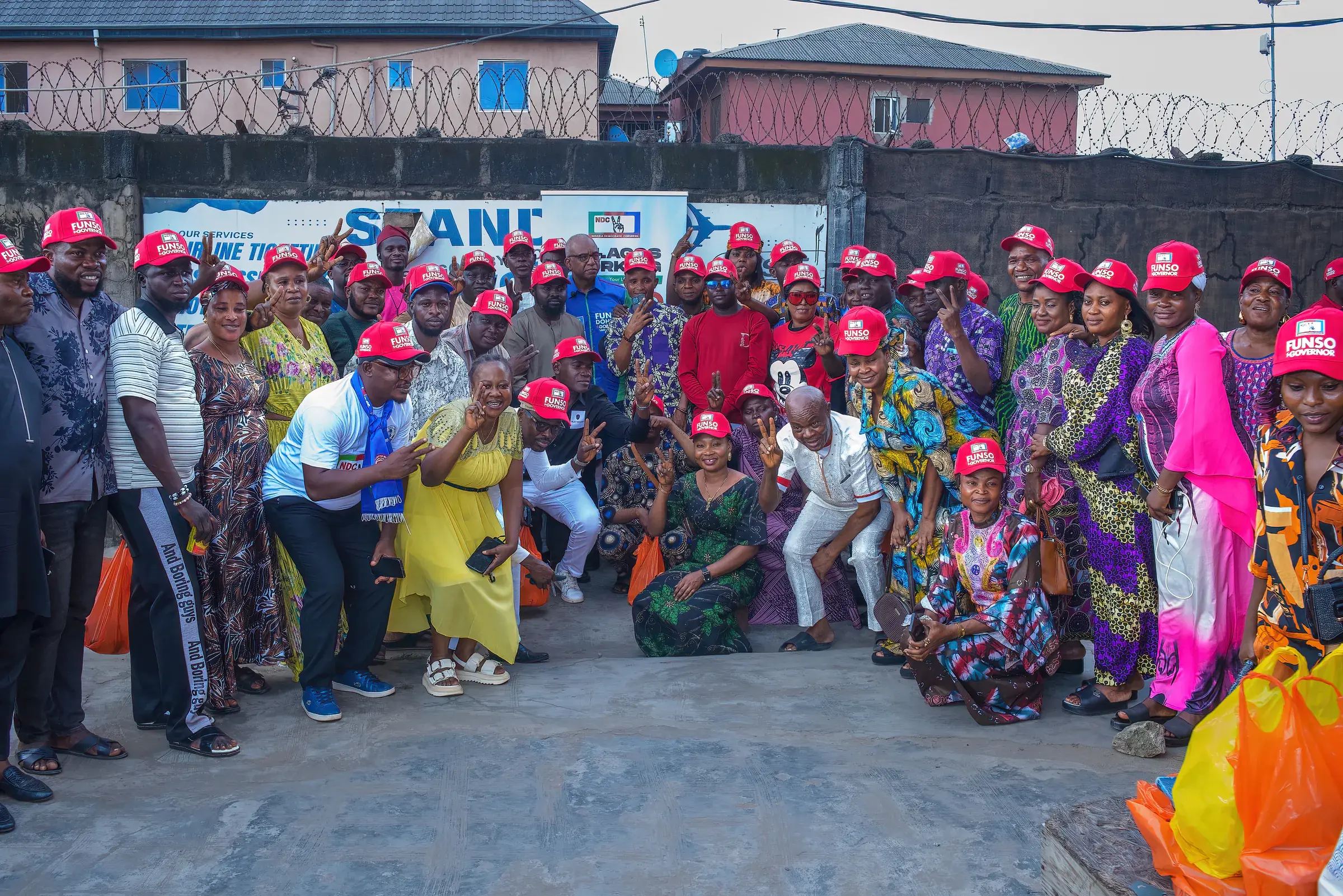 Funso Doherty with people during his visit to Alimosho.