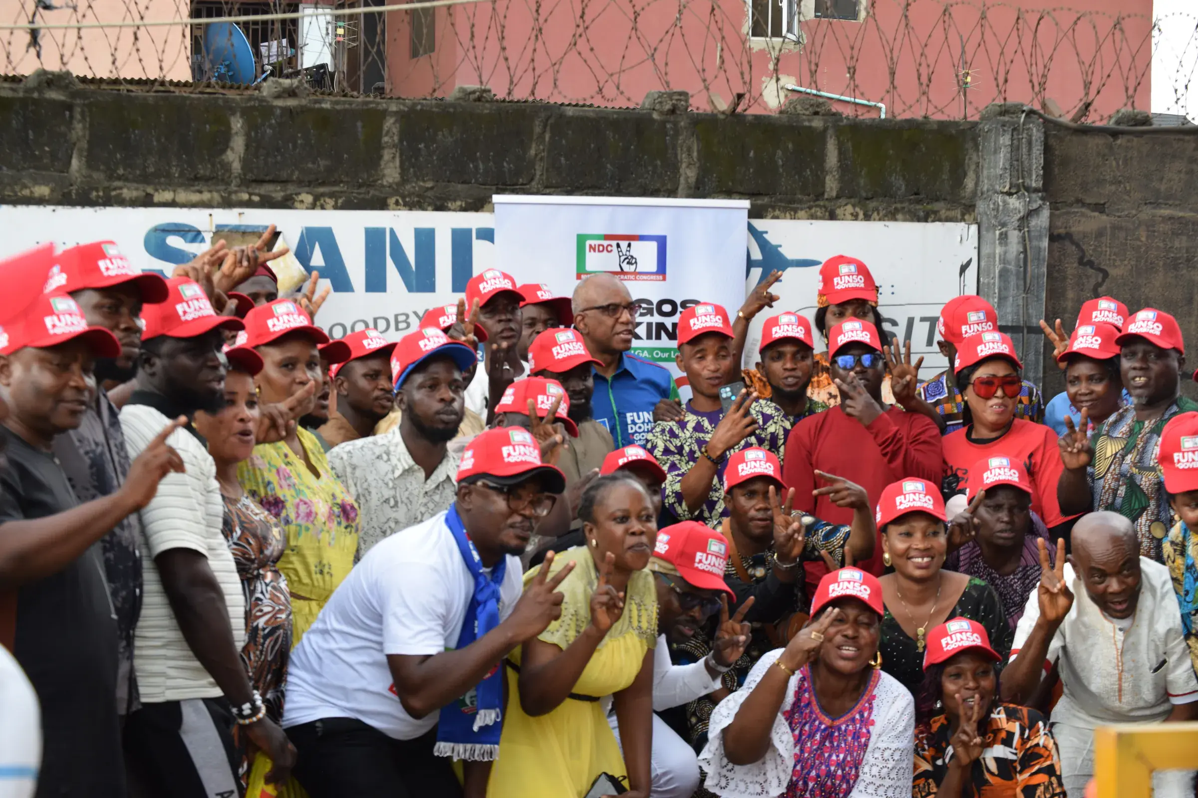 Funso Doherty with people during his visit to Alimosho.