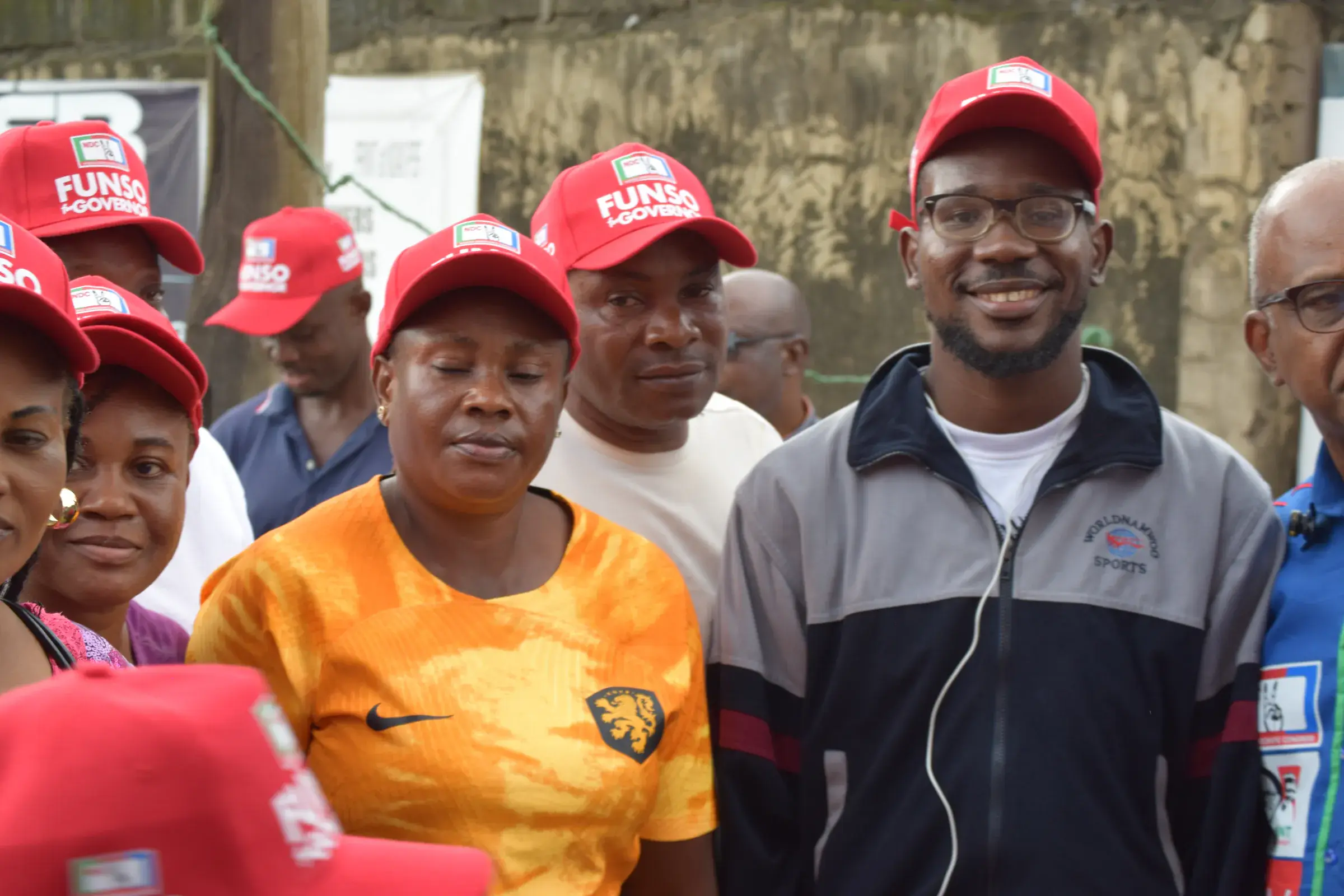 Funso Doherty with people during his visit to Alimosho.