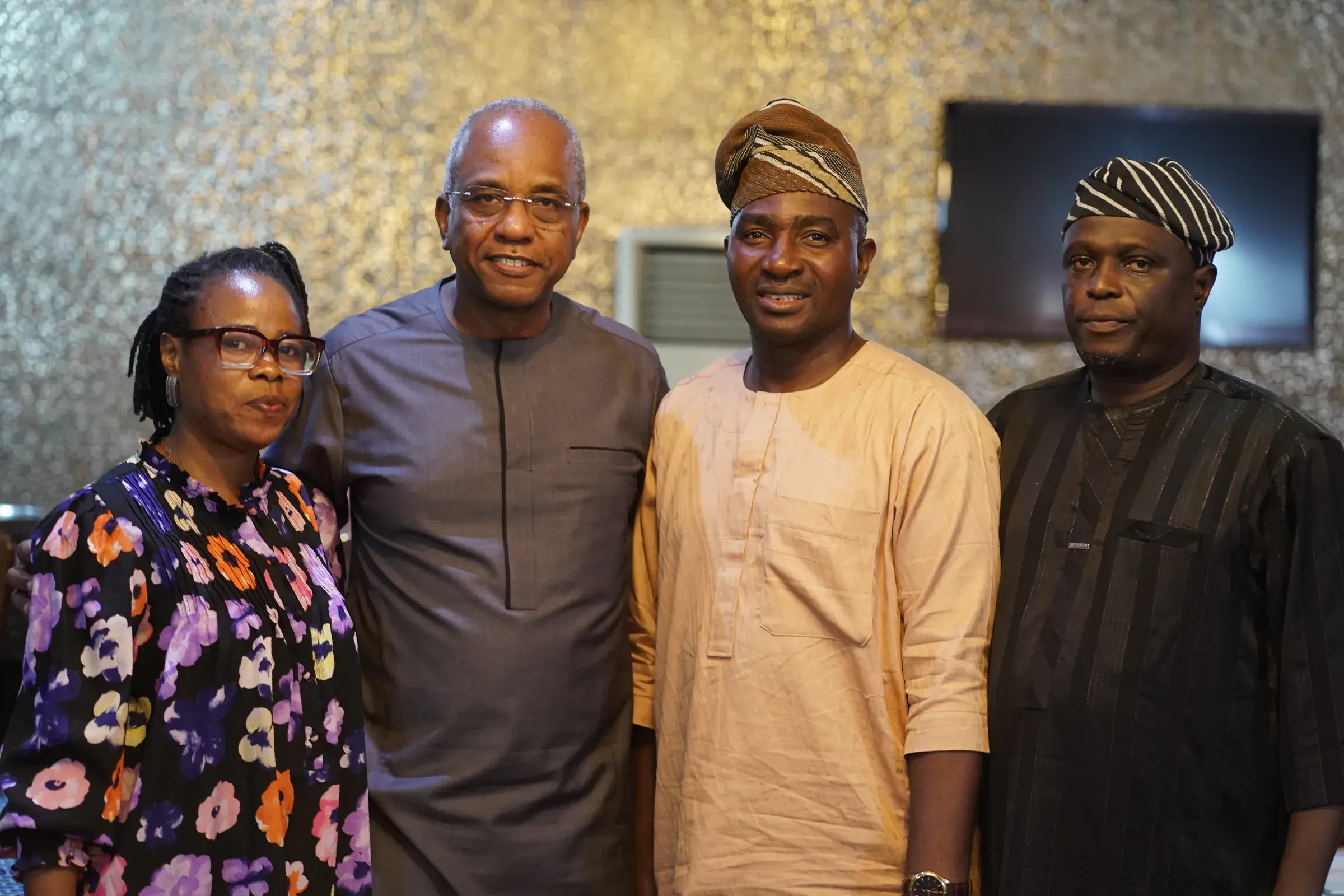 Funso Doherty with people at an NDC Lagos State executive meeting.